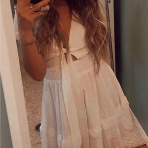 Cute white amazon mini vacay dress. Ties in the front